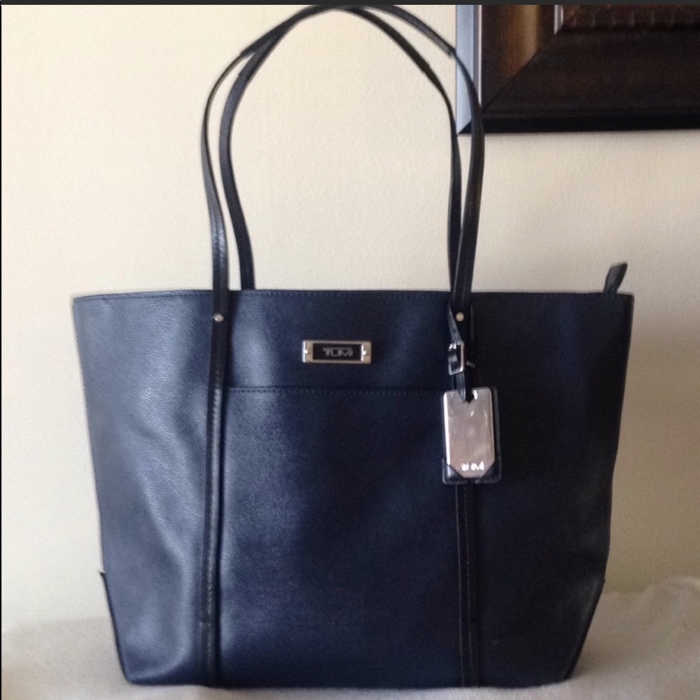 Tumi Q Blue Tote, coated canvas with leather trim.